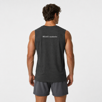 A man viewed from behind wearing a dark charcoal gray sleeveless athletic tank top with 'BEAST Aesthetics' printed in white on the upper back, paired with dark gray shorts, against a light gray studio background.