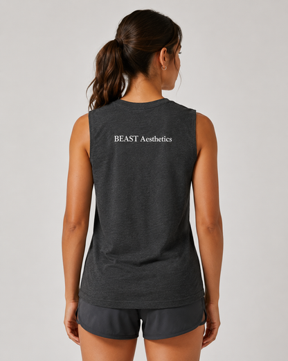A woman shown from the back wearing a dark heather gray sleeveless athletic tank top with 'BEAST Aesthetics' printed in white across the upper back, paired with matching dark shorts, against a light gray studio background.