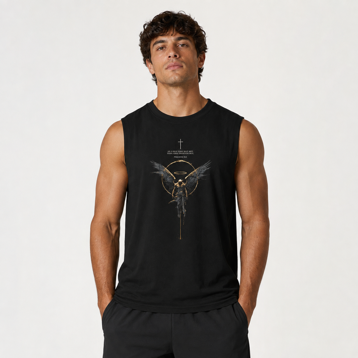 A man wearing a black sleeveless muscle tank top with a gold and white graphic of a winged figure and the text 'THE MIGHTY GHOST' on the chest, set against a plain light gray background.