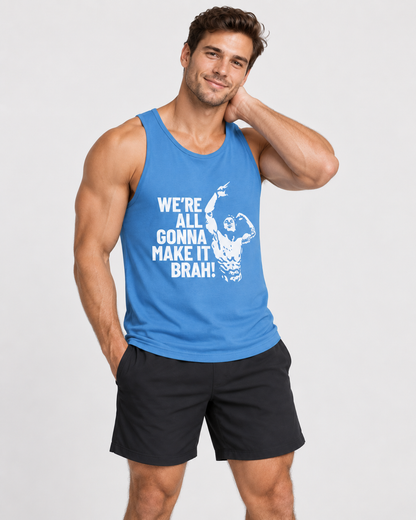 A muscular man wearing a bright blue tank top with a white graphic print that reads 'WE'RE ALL GONNA MAKE IT BRAH!' and black athletic shorts, posing against a light gray studio background.