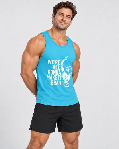 A muscular man wearing a bright blue tank top with a white graphic text that reads 'WE'RE ALL GONNA MAKE IT BRAH!' and black athletic shorts, standing against a light gray studio background.