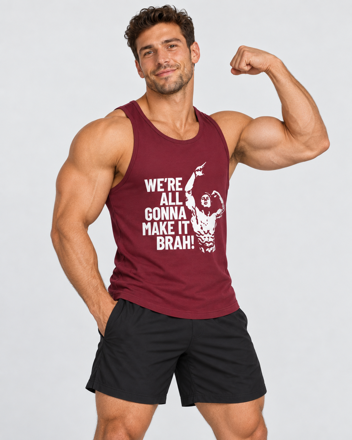 A muscular man flexing his bicep while wearing a maroon tank top with a white graphic print that reads 'WE'RE ALL GONNA MAKE IT BRAH' and black athletic shorts, against a light gray background.