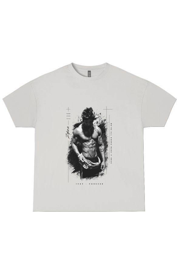 A light gray crewneck t-shirt featuring a black and white graphic print of a muscular man with a wolf head on the front, displayed flat against a white background.