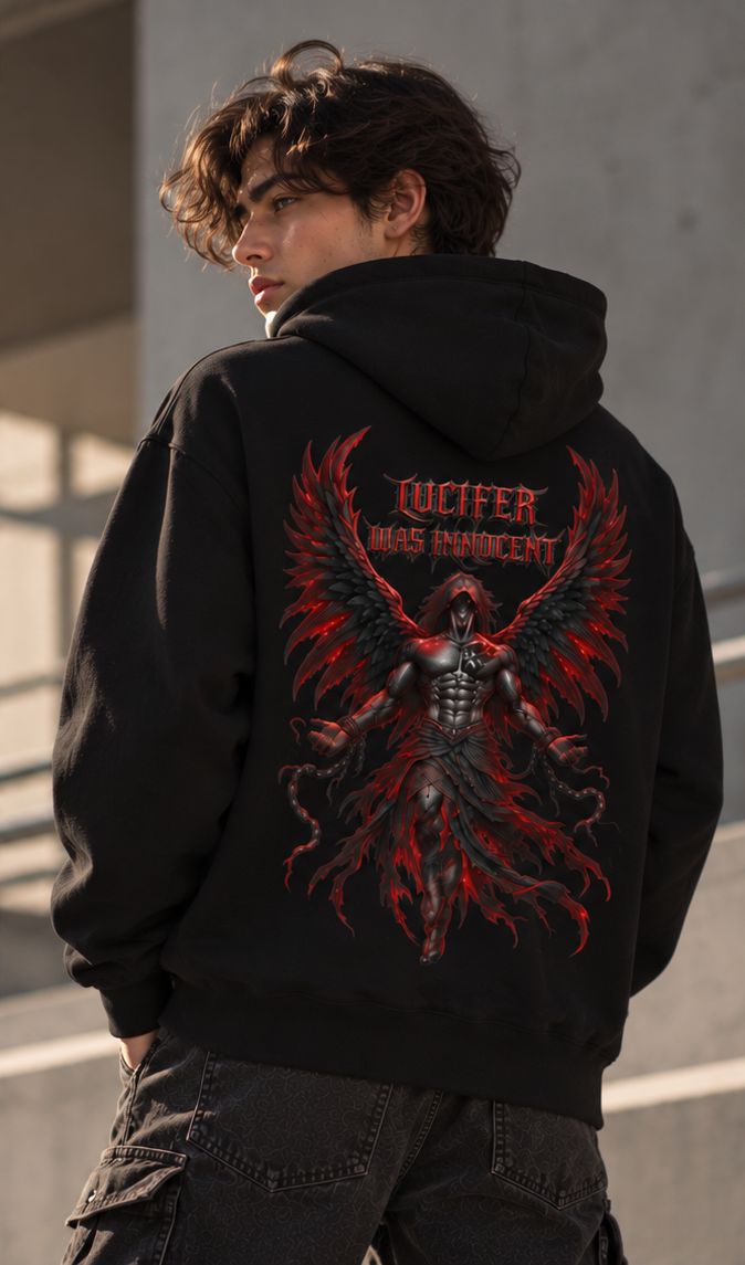 A man wearing a black hoodie from the back, featuring a large graphic print of a winged demon with red flames and the text 'JUCIFER WAS INNOCENT'.
