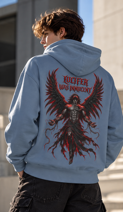 A person shown from the back wearing a light blue hoodie with a large graphic print on the back. The print features a dark winged figure and the words 'LUCIFER WAS INNOCENT' in red and black.