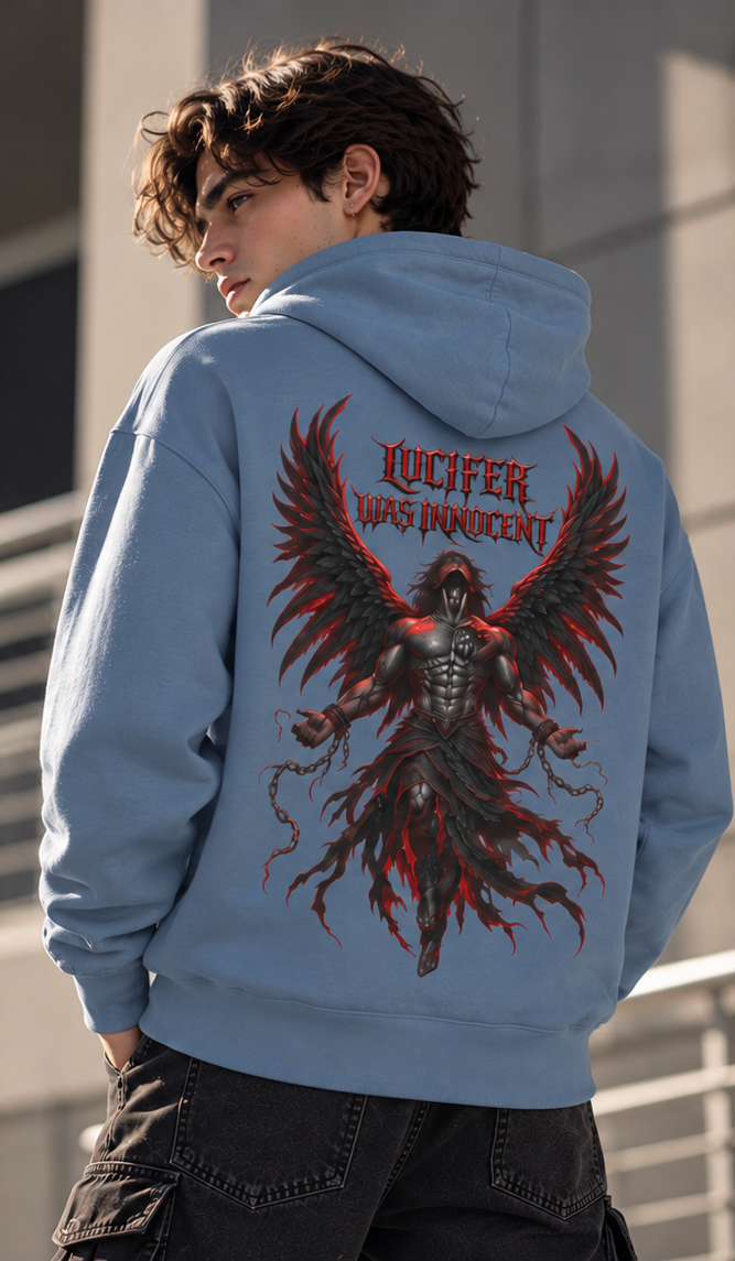 A man wearing a light blue hoodie from the back, featuring a large graphic print of a black winged demon with red highlights and the text 'LUCIFER WAS INNOCENT'.
