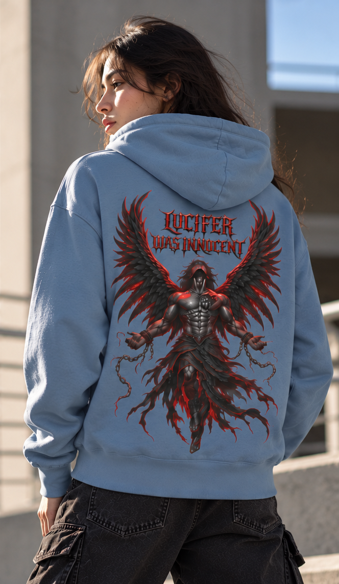 A woman shown from the back wearing a light blue hoodie with a large graphic print on the back. The print features a dark winged figure and the text 'LUCIFER WAS INNOCENT' in red.