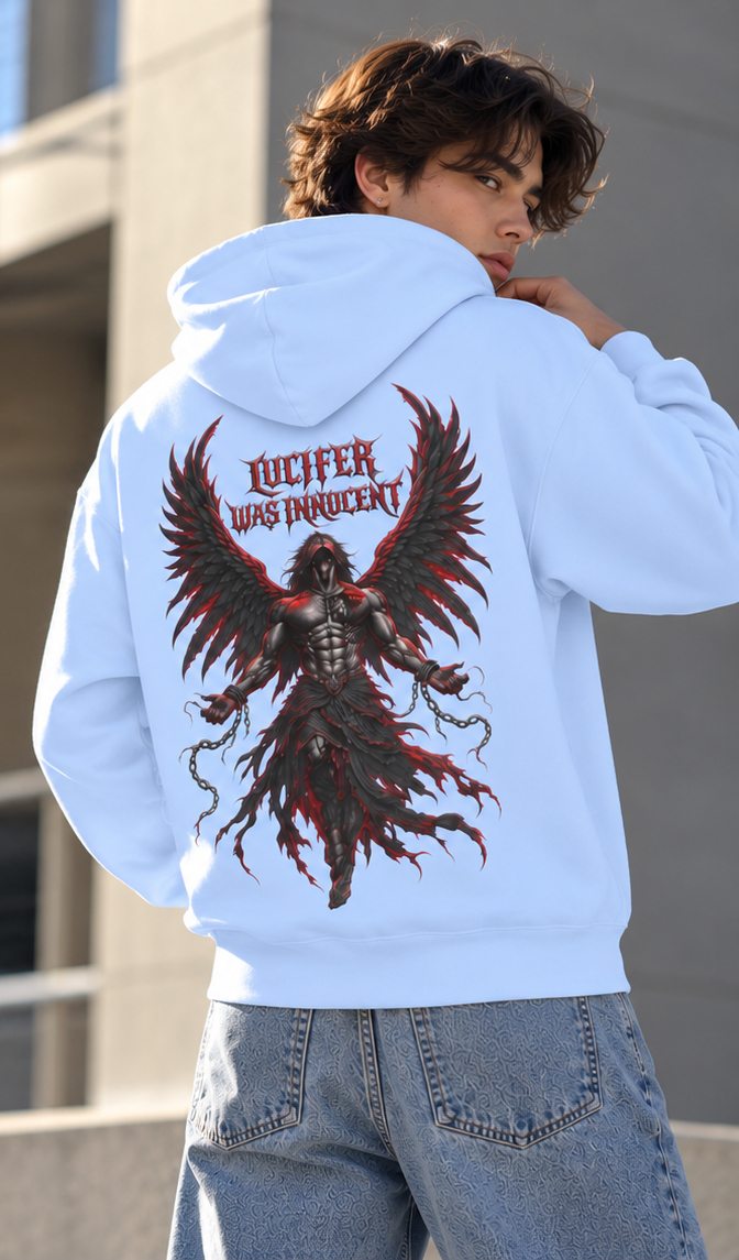 A man wearing a light blue hoodie with a large graphic print on the back, featuring a dark angelic figure with red wings and the text 'LUCIFER WAS INQUIDENT'.